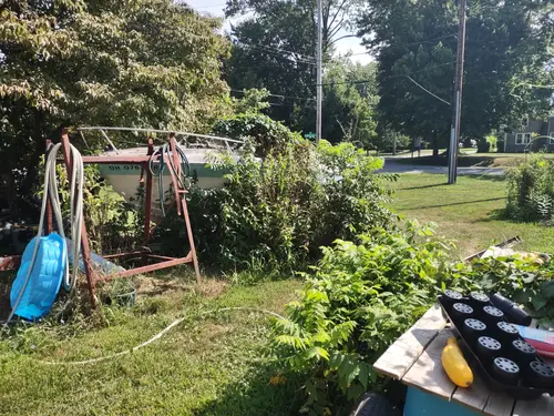 Abandoned boat in yard