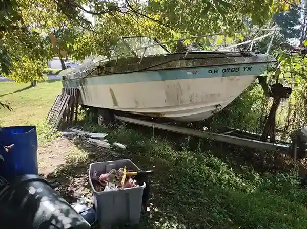Boat on trailer in woods