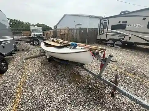 Boat on trailer in industrial lot