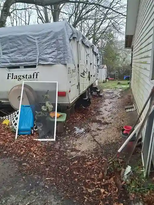 Camper parked in a side yard