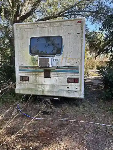 Camper rear view with moss buildup