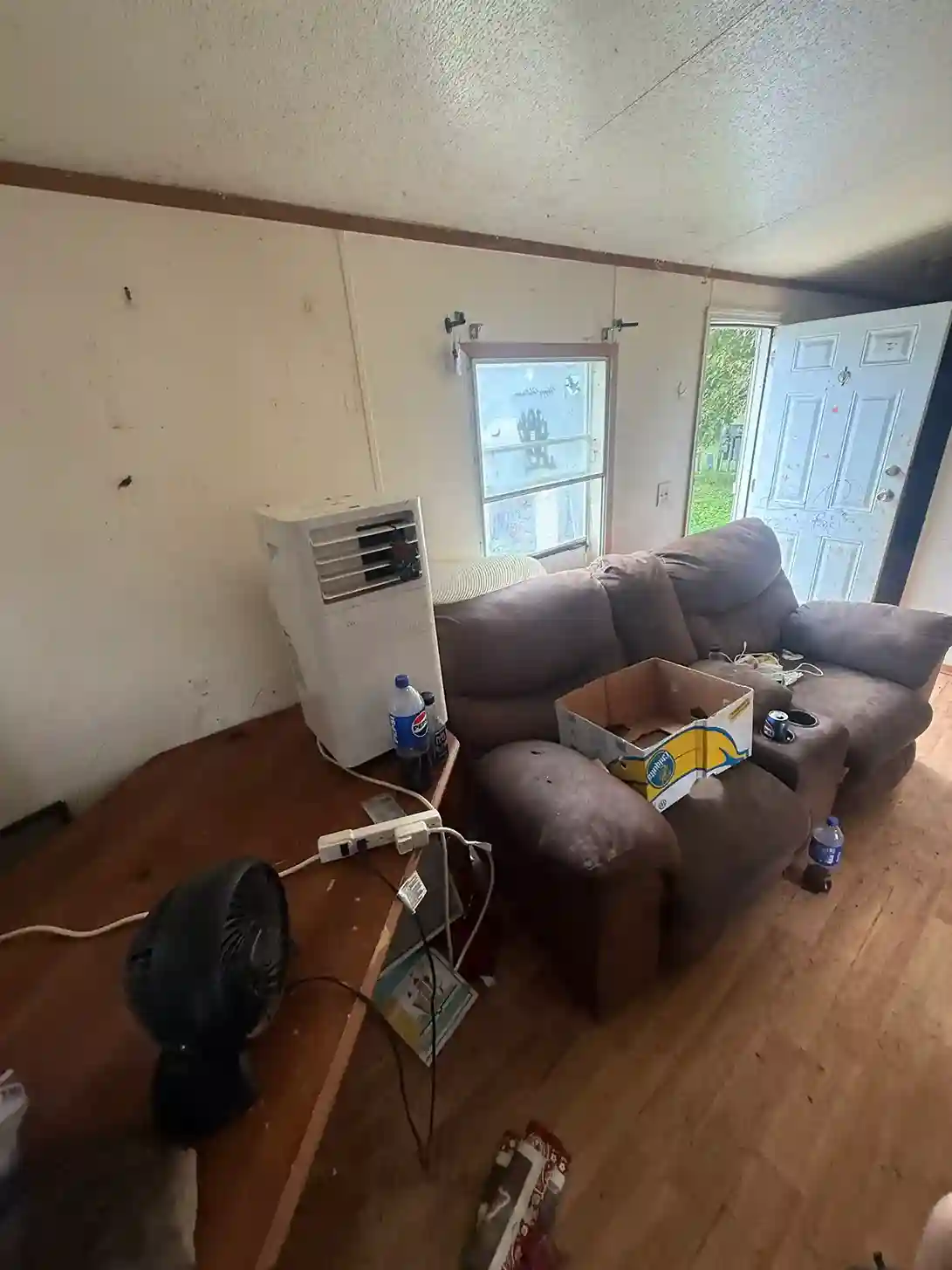 Cluttered living room with furniture