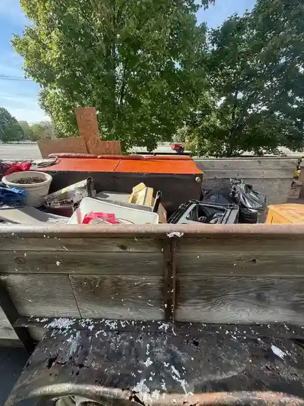 Trash bags piled in a driveway