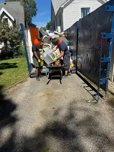 Dump trailer being loaded with junk