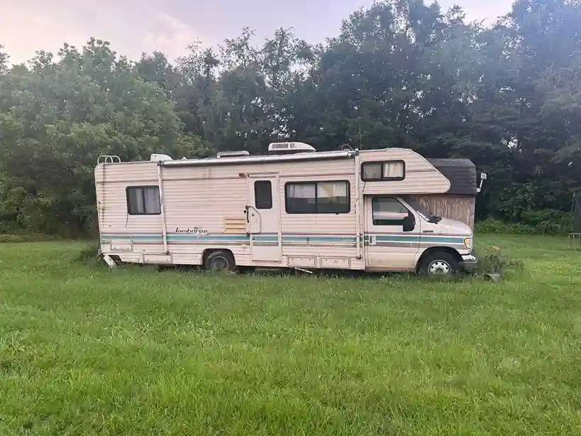 Motorhome parked in a grassy field