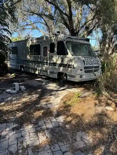 RV parked under trees