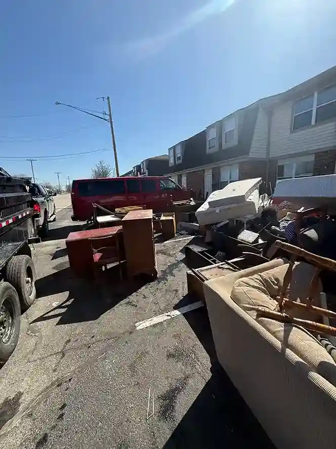 Workers loading a dump trailer